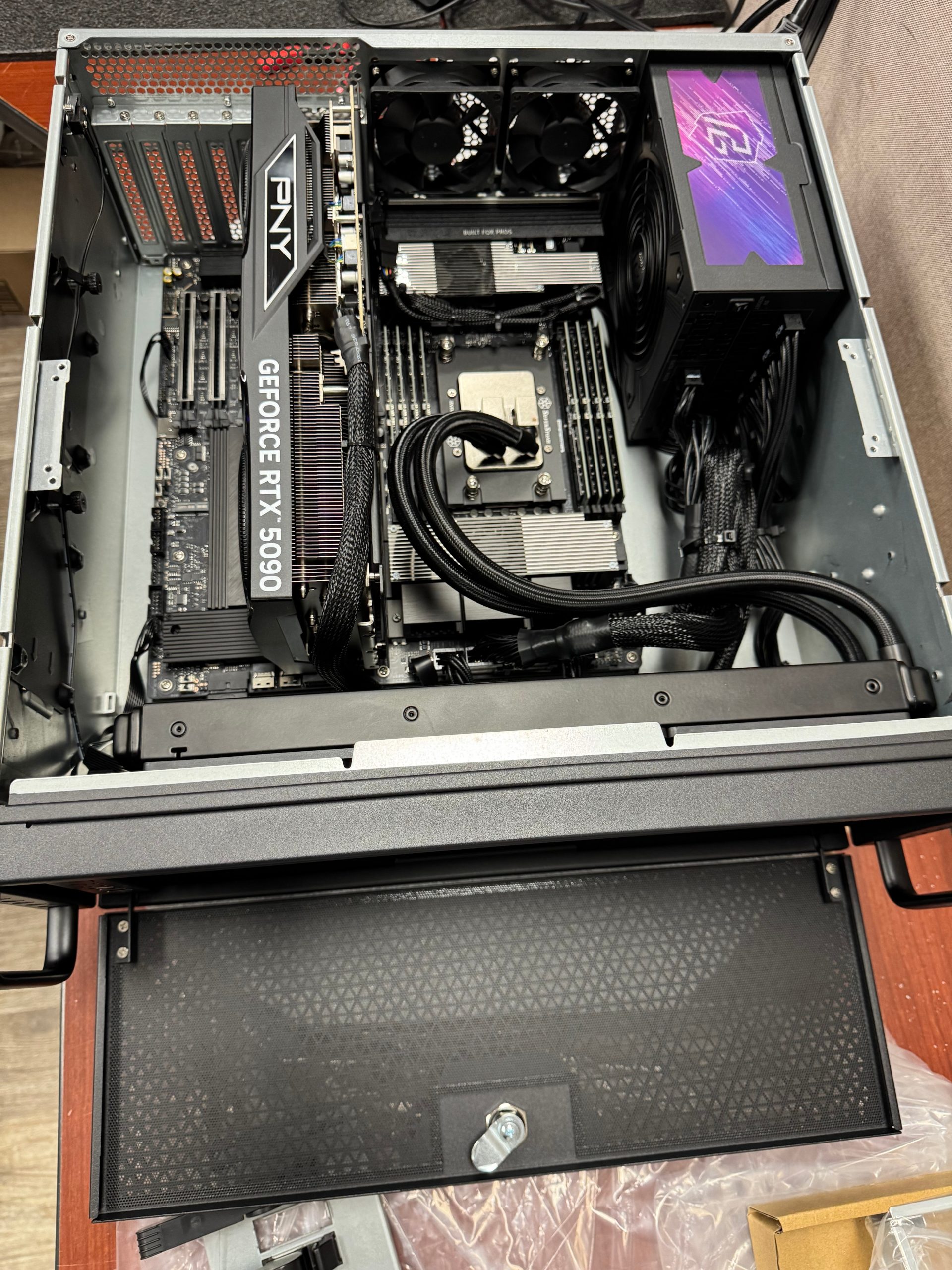 ASUS Pro WS WRX90E-SAGE SE EEB motherboard showing seven PCIe 5.0 x16 slots and dual PSU connectors