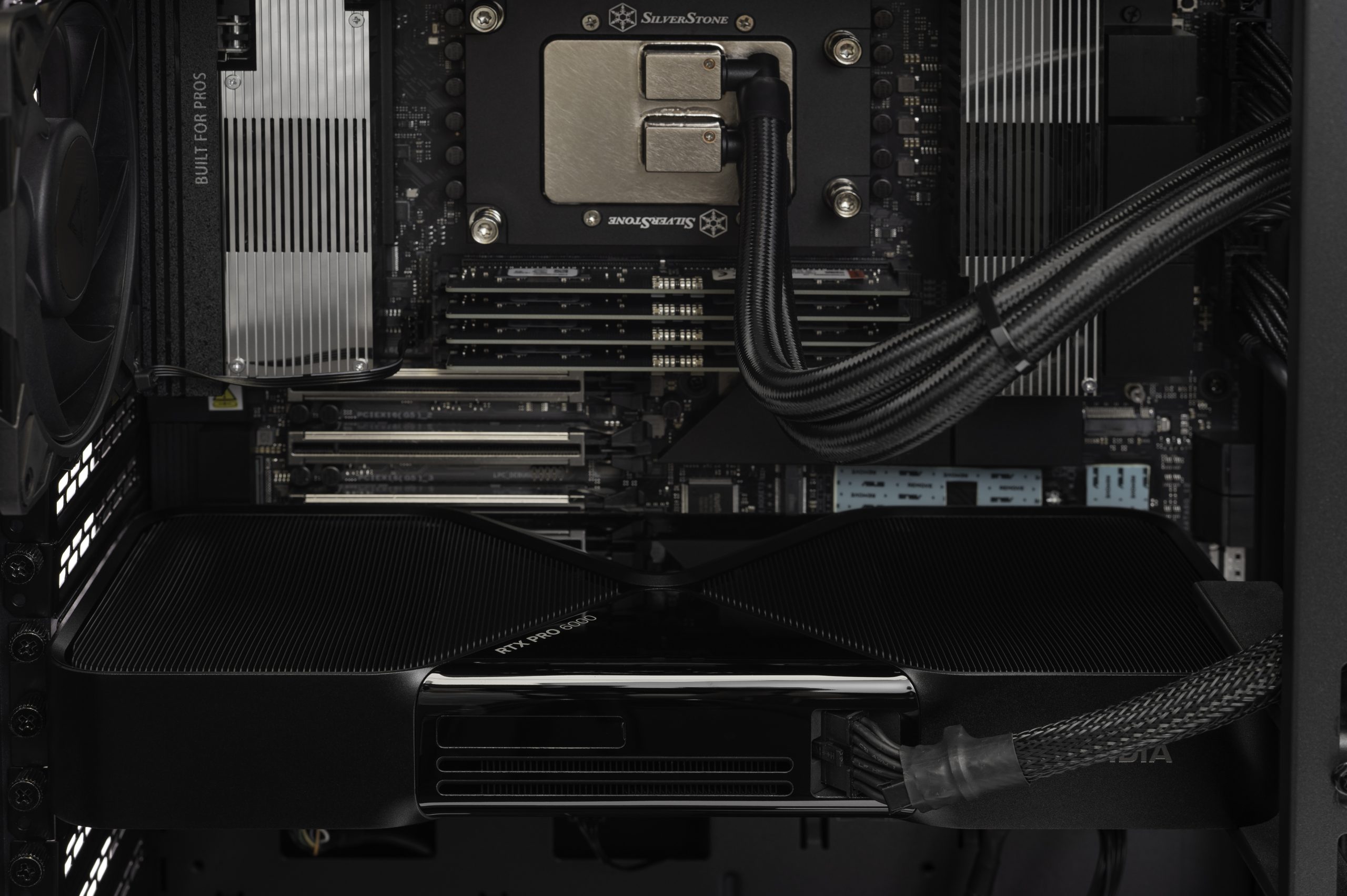 ArsenalPC AI workstation featuring RTX 5090 and Threadripper platform under sustained GPU compute load with temperature monitoring overlay