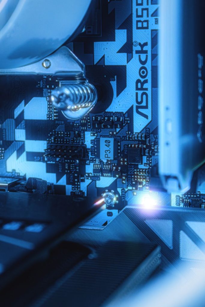 ASRock B550 motherboard inside a PC under blue lighting